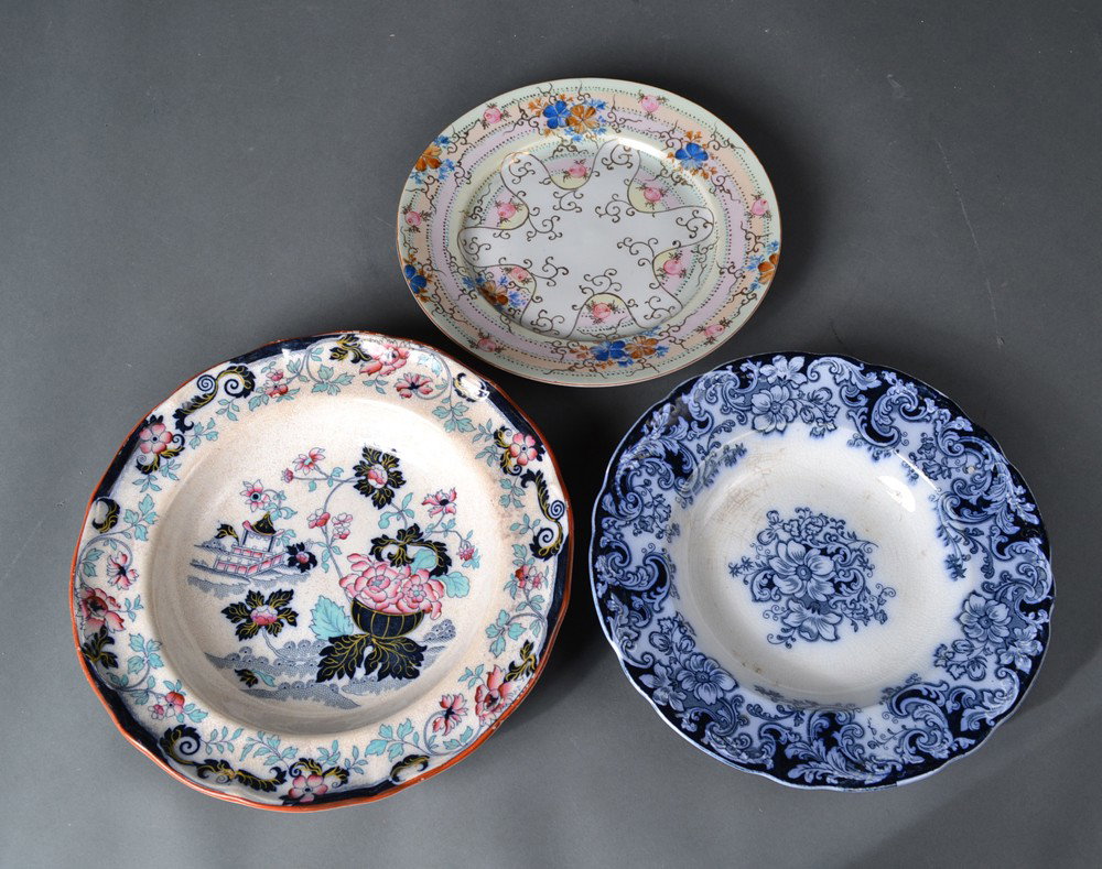 Grouping of (3) Porcelain Serving Pieces: To include an Alfred Meaking flow blue bowl, a floral decorated bowl, and a plate with flowers and heavy gilt. Largest 10.25" Dia. With crazing and minor staining.