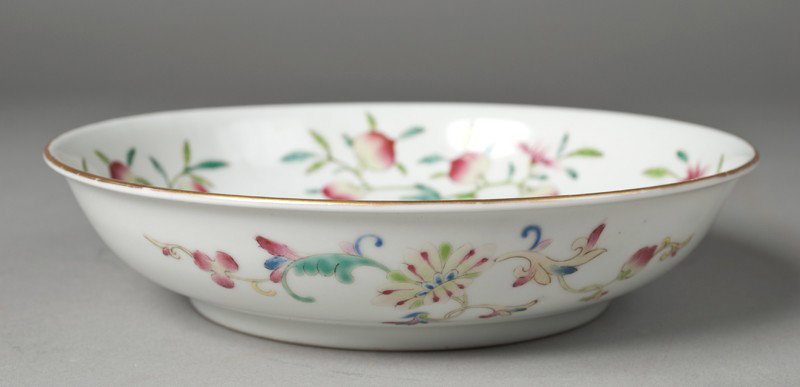 Chinese Famille Rose Porcelain Bowl: Finely enameled to depict large gilt symbol with bats and peaches to interior, and floral designs to exterior with gilt rim. Six character mark in iron red on underside. 1 & 7/8" H x 7 & 7/8" Dia., ci