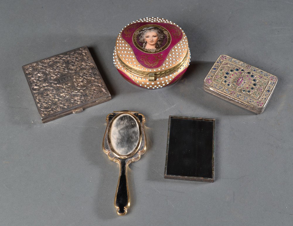 (5) Ladies Dresser Accessories: To include a circular porcelain dresser box with portrait medallion of a lady with raised turquoise jewels, an enameled hand mirror with gold frame, two compacts one probably silver plate with etched 