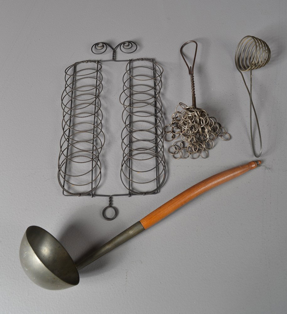 (4) Pieces American Wood & Tin Kitchenware: To include a turned wood handle and pewter dipper with fine turnings, a pot scrubber, an egg seperator, and tin wall rack. Largest 14.5" L. Circa 19th century. Private collection Gregory, MI.