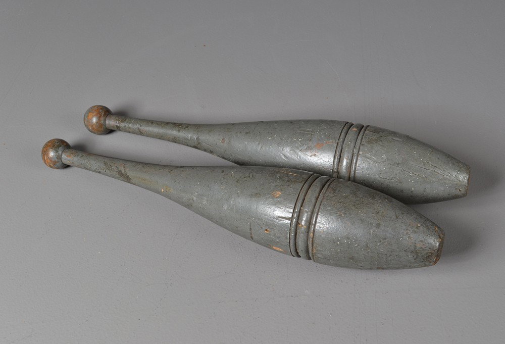 Pr. Of American Carved and Painted Juggling Pins: With incised carvings and ball tops, in original gray paint. 18" H. Circa 19th century. Private collection Gregory, MI.