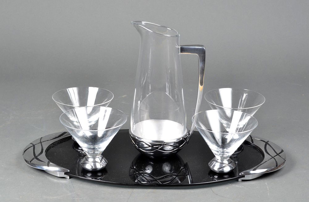 Lenox (6) Piece Art Deco Beverage Set: To include four martini glasses and a pitcher trimmed in chrome, on a smoked glass tray. Tray measures 20" L. Circa 1920's. Private collection St. Clair, MI.