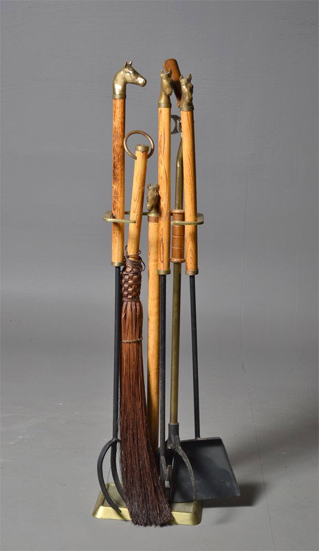 A Custom Made (6) Piece Signed Fireplace Set: Constructed of brass iron and wood with horse-head finials, with initials makers mark B within a circle to most of the pieces, to include a log gripper, a pitch fork, a log hook, a ash shovel, and a b