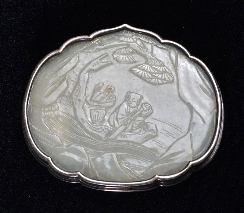 Chinese Qing Silver Mounted White Jade Plaque: Finely carved to depict a boy rowing a boat, 18th-19th C., 2.75"W X 2.3/8"H.