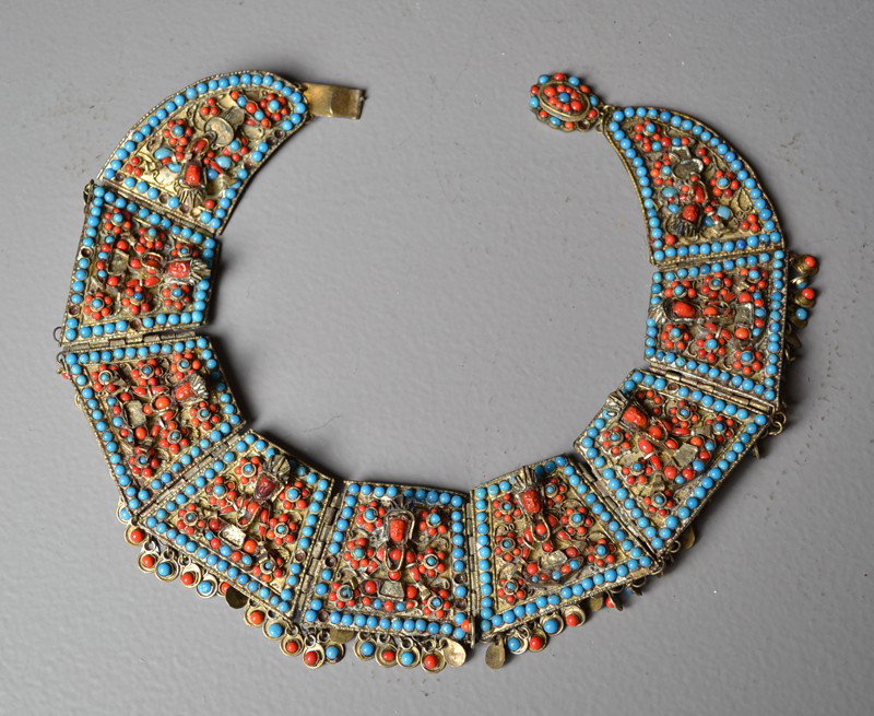 Chinese-Tibetan Necklace: Having coral, amber, and turquoise inlaid to depict seating Buddha, 19th C., 8.5"W X 7"H.