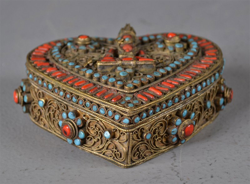 Chinese-Tibetan Heart Shaped Brass Box: With coral and turquoise inlaid depicting a seating buddha, 4"H X 4.25"W X 1.25"D.