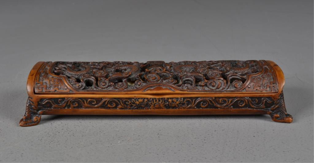 Chinese Qing Bone & Bakelite Chopsticks Set: To include ten etched and ink decorated bone rests, twenty etched bone and bakelite chopsticks in lift lid presentation box molded to depict multiple dragons and symbols resting on four claw feet the