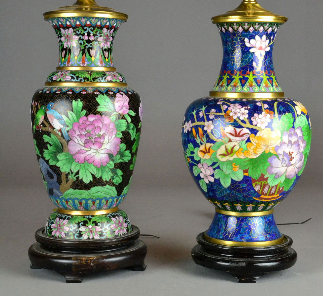 (2) CHINESE CLOISONNE TABLE LAMPS: Including a pair of cloisonné decorative table lamps with flowers and tendrils, one with a blue ground, the other with a black ground, on a wood stand, with custom silk lampshades.34" H early to mid