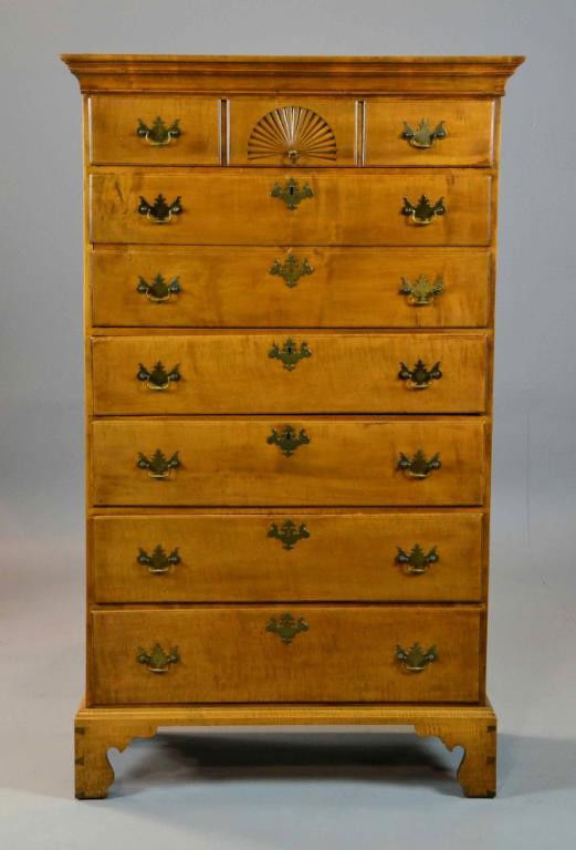 An American Chippendale Tiger Maple Tall Chest of Drawe: An American Chippendale tiger maple chest of drawers, with a large molded cornice, six drawers, top drawer with central fan carving, the second drawer with two fronts, each drawer with original brass