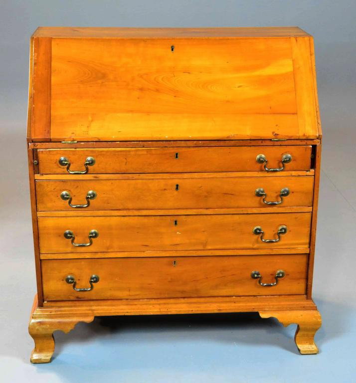 AN AMERICAN 18TH CHIPPENDALE DROP FRONT DESK: An 18th century, American southern pine drop front desk, dropped front opening, nine pigeon holes, with seven hand cut dovetail drawers, with original pulls, including one with a fan design, over four
