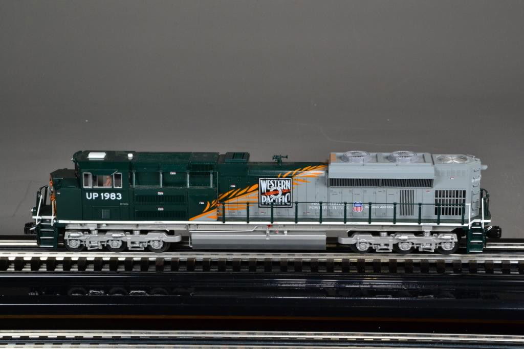 LIONEL LOCOMOTIVE - UNION PACIFIC: Very nice Union Pacific Heritage Western Pacific SD-70ACe diesel locomotive, Legacy speed control, rail sounds, two motors, directional lighting, electro couplers (#6-28262), new in box. Private colle