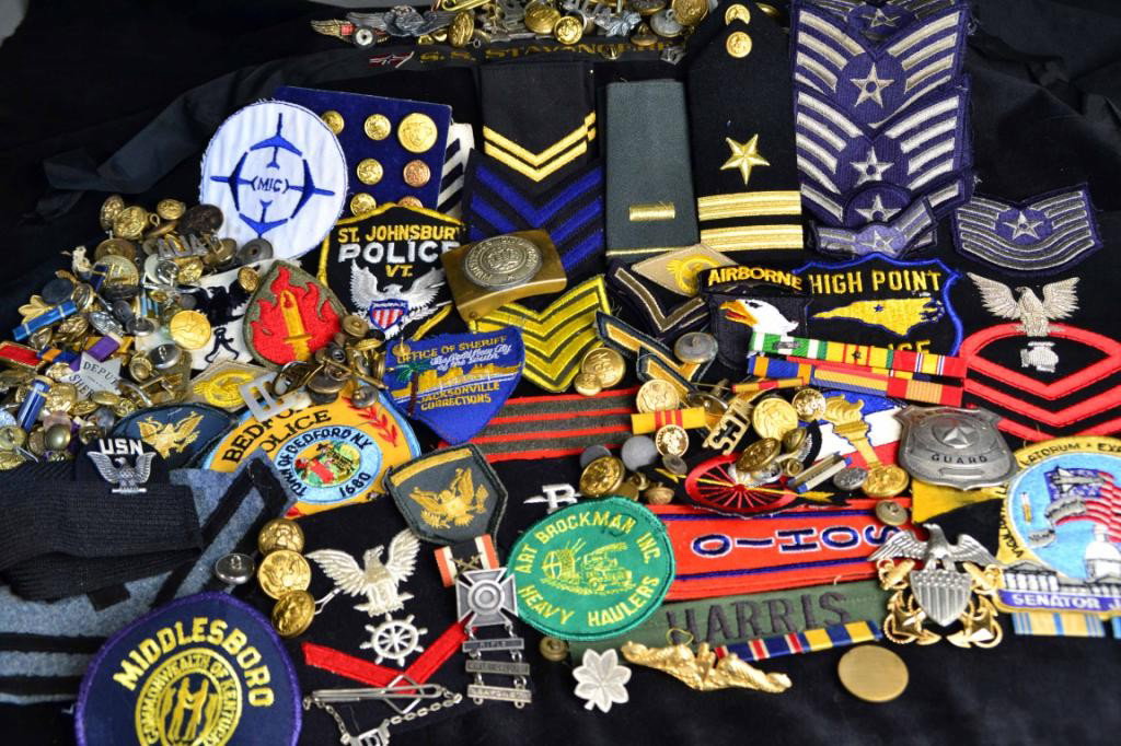OVER 200 MILITARY & POLICE PATCHES AND BADGES: Wide assortment of police and military patches, medals, buttons, etc. Some examples include: Bedford NY police patch, office of sheriff Jacksonville corrections patch, airborne patch with eagle head p