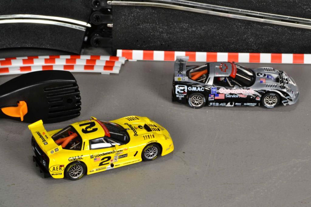 (3 BOXES) SCALETRIC SLOT CAR & EXTRA TRACK: Including two cars, one silver car and one yellow car with complete track set up along with two track extension packs C8035 & C8036, all new in box. Private collection Metamora MI.