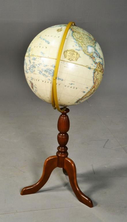 16" DIAMETER NATL. GEO. GLOBE ON STAND: Large 16" diameter National Geographic globe on ornate wooden three legged stand, post 1990, showing newly created E. European states, 36" H. Private collection Metamora, Mi.