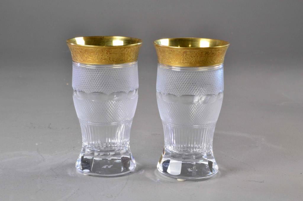 (2) MOSER GLASSES WITH GOLD EMBOSSED RIMS: Pair of elegant matching heavy gold-rimmed crystal panel-cut glasses, cross-hatched design on body, 6" H, marked on bottom with Moser name, excellent condition. Private collection Metamora, MI.