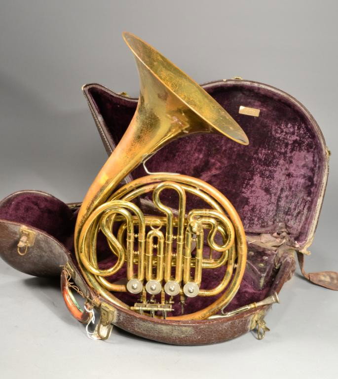 HEWITT'S LEATHER CASE AND FRENCH HORN SIGNED: French horn and case,signed Lokenzo Sansone, circa early 20th century, some damage with brass wear. Private collection Metamora MI.
