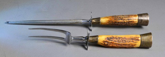 CARVING SET WITH STAG HANDLE STERLING POMMEL: Very nice meat carving set consisting of stag handled knife and sharpener with sterling silver pommel and hilt, 16" overall, mid 20-th century. Private collection Metamora, MI.