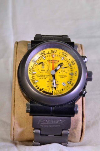 FORMEX 4-SPEED TS 375 MEN'S WATCH: Swiss made men's watch of titanium steel, brushed steel bezel and band, black mounting. Limited edition numbered #389/999, bright yellow face with luminous hands and markings, red second hand, brushed