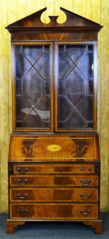 CHIPPENDALE INLAID DROP-FRONT SECRETARY: Beautiful English Chippendale-style drop-front secretaire with pull out supports for desk, central sunburst inlay, having arched pedimet and molded cornice, two glazed doors with chequer and feather s
