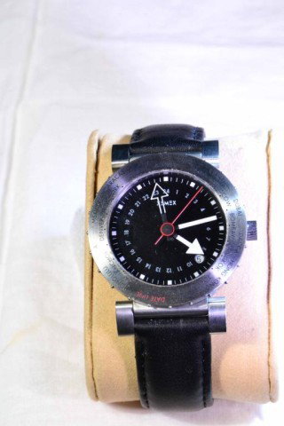 XEMEX 1150-389 MEN'S WATCH: Swiss made, black wooden box, black face, with world time zones, black leather band, excellent condition.