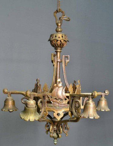 A FINE BRONZE ART DECO CHANDELIER: Manufactured by Lincoln lighting co, depicting a sailing ship motif, with bell flower form sockets, the surface hand hammered, 26" H x 20.5" W. Circa 1920's. Condition very good to excellent with the 