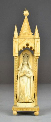 A Fine European Carved Ivory Tryptich: In ecclesiastical steeple form carved to depict a figure of mother Mary with crown and robe, with center of robe opening to reveal carvings of the crucifixion of Jesus, raised on double platform with