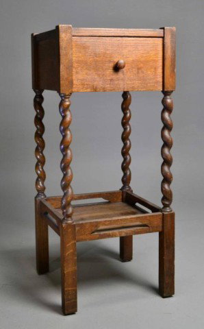 OAK SMOKING STAND WITH BARLEY TWIST LEGS: Charming smoking stand with carved barley twist legs, featuring single top drawer with single shelf underneath, top is recessed for ashtray, circa 1940's, 27.25" h., 5" h. drawer, 11.75" square top , 