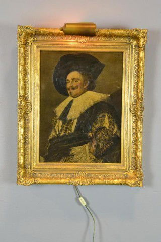 FINE GILTWOOD AND COMPOSITION FRAME WITH LIGHT: Beautiful gilt frame in Baroque style with shell decoration and scrollwork, with overhanging display light, contains reproduction of Frans Hals "Laughing Cavalier", 12" x 16" sight, 17.5" x 21.5" x 2.