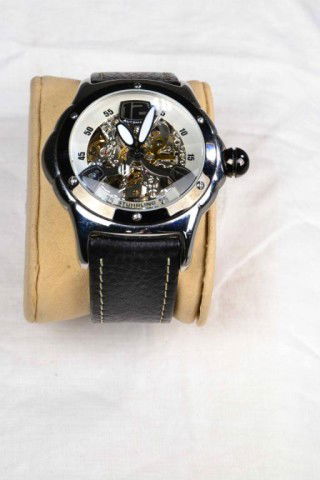 STUHRLING MEN'S WATCH W/ MOD NUMBERS: Handsome men's watch with skeleton movement, all stainless steel, 20 jewels, Lexus automatic, water resistant to 50 meters, black leather band, excellent condition. Private collection Metamora, MI.