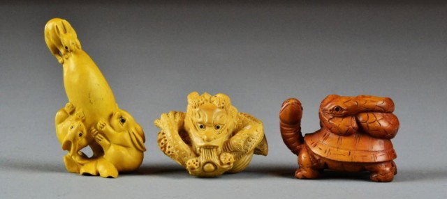 (3) Fine Japanese Carved Boxwood Netsuke: Finely carved to depict a snake on a turtles back, a group of three rabbits climbing a gourd, and a coiled dragon, largest 2.75"H, possiblly Meji period, circa early 20th century.