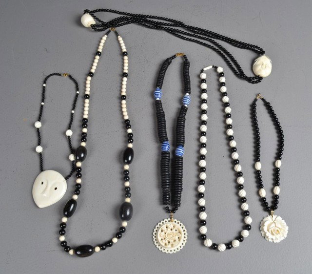 (7)Chinese Carved Ivory & Onyx Necklaces: Finely carved in various styles, to include ivory medallions, some of flowers, one of a face with inked and dyed elements with two character mark to back, longest is 37" L, circa 20th century, some me