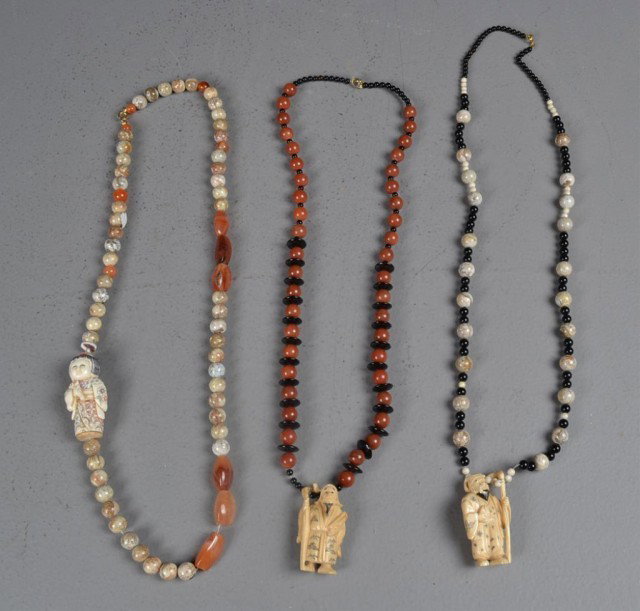 (3)Japanese Carved Ivory Netsuke Necklaces: Finely carved with semi precious stones, each with a netsuke to include two with elders holding staffs, and one female, two elders have character marks on left foot, longest is 30.5" L, necklaces made
