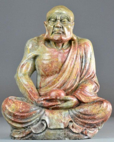 A Large & Fine Chinese Shoushan Stone Lohan: Finely carved to depict a seated Lohan holding a water pot, with incised gilt decoration to the robe, the water pot signed in gilt with two character mark, the stone finely carved and very well polish