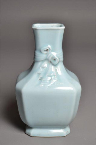 Chinese Blue Celedon Porcelain Vase & Ribbon: Light blue celedon square and footed vase having molded ribbon around neck and slightly flaring rim, underglazed blue seal on bottom, 11" H x 7.25" L x 5.5" W.