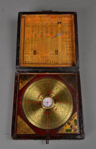 Chinese Boxed Compass & Level: The outside finely painted to depict birds on branches amount lotus blossoms opening to a paper lined interior with Chinese symbols, compass with a plaque in each corner two with the Pyongyang symbol 