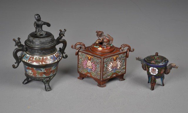 (3) Chinese Cloisonne And Enamell Censors: To include a cloisonné tri pod censor painted with character marks and lotus blossoms with two dragon head handles, also to include a copper censor painted to depict lotus blossoms with chi long hand