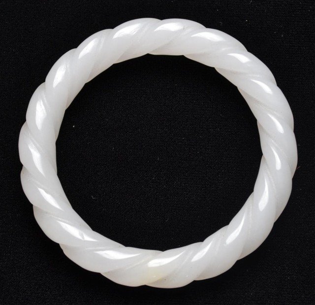 Chinese Carved White Jade Twisted Bangle: Finely polished white jade bangle, 3" Diameter, .5" thick. Private collection Rochester Hills, MI.