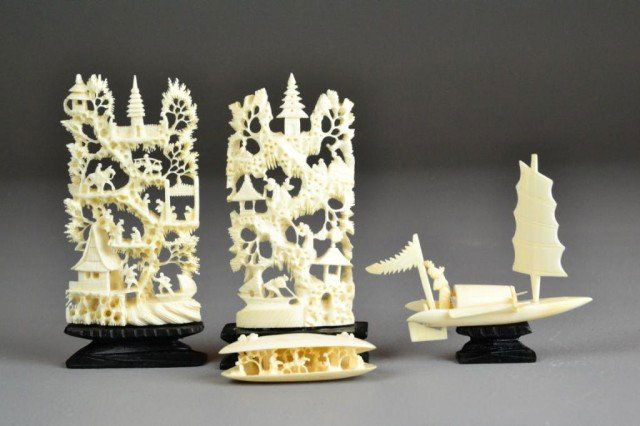 (4) Chinese Carved Ivories: Depicting two mountains on wood stands, a carved open clam depicting figures with in a landscape, and Chinese junk on wood stand, largest is 4.5"H including the stand.