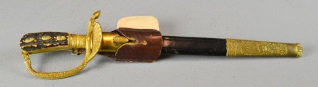 Imperial German Hirschfanger (Cutlass) Knife: With finely cast gilt bronze guard depicting wheat design ending in hoof feet at both ends, with clam shell blade guard, engraved blade depicting a hunting scene to both sides, the blade is further do