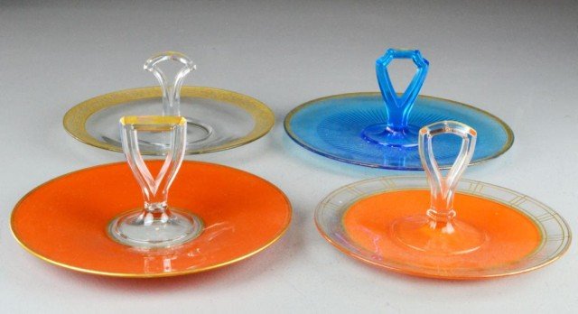 (4) Glass Cake Servers with Handles: To include four cookie or petit-four glass servers each having serving handle in center, two are orange, one is blue glass and a fourth is clear with gilt enamelled rim decoration, largest is 10.5" Di
