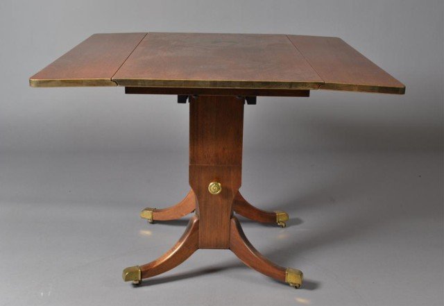 Regency Style Drop Leaf Combination Table: With saber legs, original brass caps and converts easily to a coffee table. 26.75" H x 36" L x 20" W. Circa early 20th century. Private collection Detroit, MI.