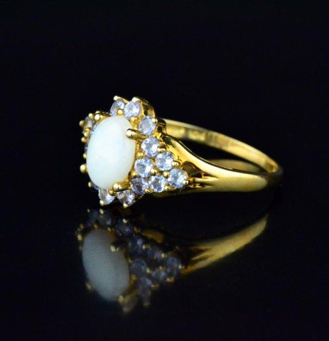 10K Ladies Gold Opal Ring: A 10K- 1.95 g yellow gold .75 ct - 8 x 6 mm oval opal & .65 ctw tanzanites ring size 7.