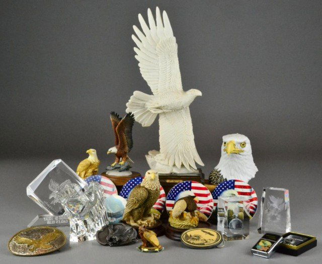 (26)Various Eagle Items Including Steuben Crystal: To include ten various sized eagle statues, five eagle coasters, three belt buckles, and two cigarette lighters, etc. the largest 15.25" H, circa 20th century.
