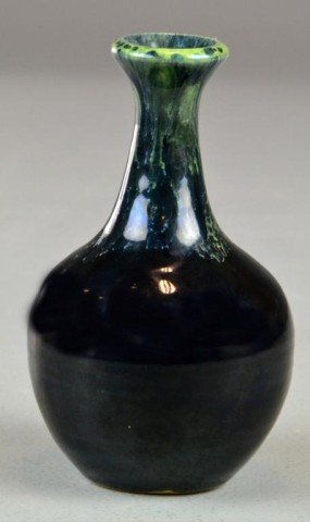 A Van Briggle Bulbous Form Pottery Vase: In bulbous form with black and teal glaze. 5.25" H, circa early to mid 20th century.