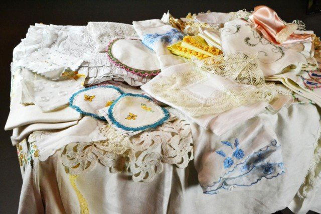 Large Lot of Table Linens: Collection of table linens, pillow cases, dresser scarves, some hand-embroidered, circa mid 20th century, Private collection Clarkston, MI.