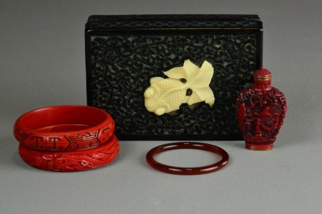 (5) Pcs. Chinese Carved Cinnabar: To include a black cinnabar box and cover inlaid with carved bone or ivory carp, a carved cinnabar snuff bottle with character seal to base, two cinnabar bangle bracelets carved with various motif, on
