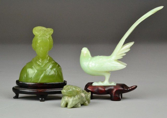 (3) Chinese Carved Serpentine Jade Items: Including finely carved and polished jade bust of a lady 3.5" H with wooden stand, a light green carved pheasant 5" H on wooden stand along with carved jade kneeling ox 2.25" L. Private collection Mad