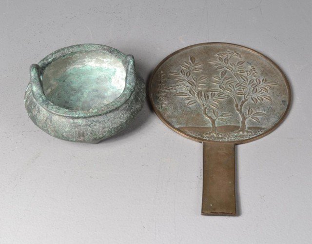(2) Pieces Chinese Bronze: To include a censor of Ming style with two handles and three feet, with seal mark to the base, 5.5"W X 3"H, together with a bronze mirror molded to depict cherry blossom trees, signed left center, 11"