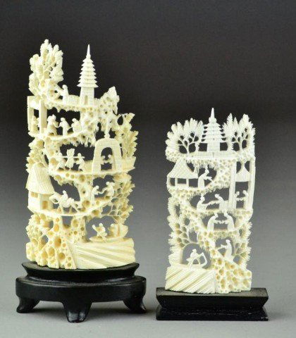 (2)Chinese Carved Ivory Mountains: Each carved in the half round, depicting landscape and figures, each affixed to a hardwood stand, tallest is 7.5"H, circa early 20th century.