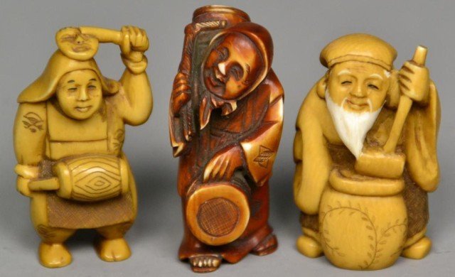 (3)Japanese Carved Ivory Netsuke: Probably Meji period, finely carved, one to depict an old man with large pot, one of a comical figure, and one of a hunched back old woman with baskets, tea stained with inked and dyed elements, all w